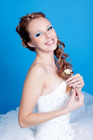 Beautiful blond bride photo in studioの写真素材