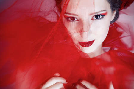 Beauriful girl in red tulleの写真素材