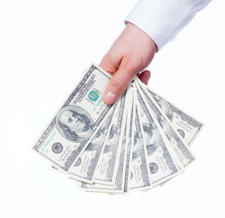 A man s hand holding a handful of dollarsの写真素材