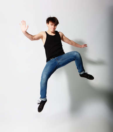 Young man juming in studioの写真素材