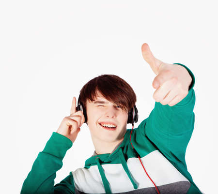 Young man listening music in studioの写真素材