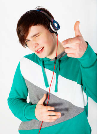 Young man listening music in studioの写真素材