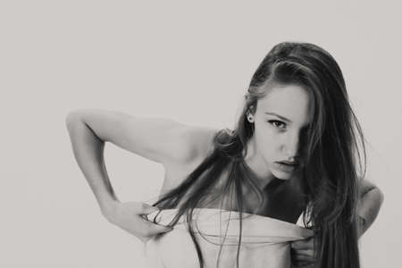 Young girl grayscale photo in studioの写真素材