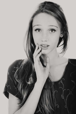 Young girl grayscale photo in studioの写真素材