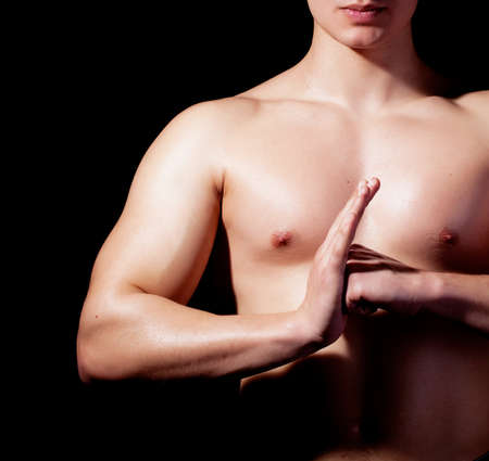 Low key image of young fitness man の写真素材
