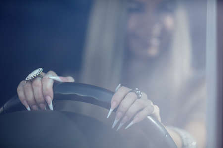 Beautiful girl in the carの写真素材