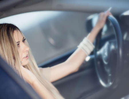 Beautiful girl in the carの写真素材