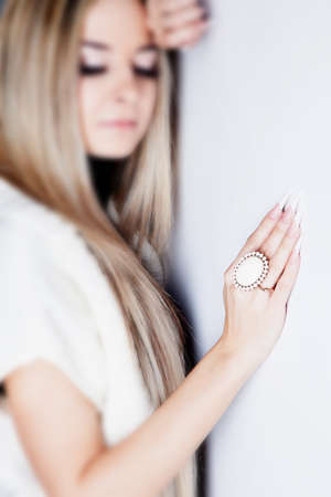 Sexy young lady hand with large ring on fingerの写真素材