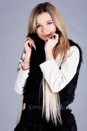 Sexy young lady with blond hair in studioの写真素材