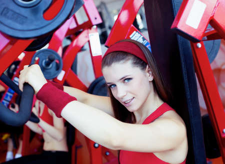 Beautiful girl in fitness center の写真素材