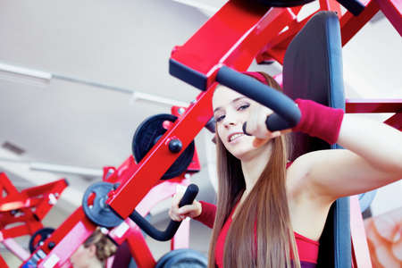 Beautiful girl in fitness center の写真素材
