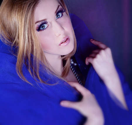 Young beautiful blonde in studioの写真素材
