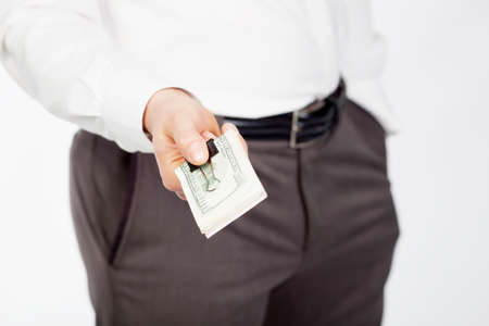 Man holding dollars in hand isolared on white