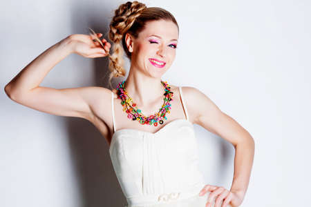 Smiling woman with hairstyle studio portraitの写真素材