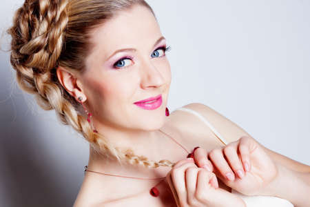 Smiling woman with hairstyle studio portraitの写真素材