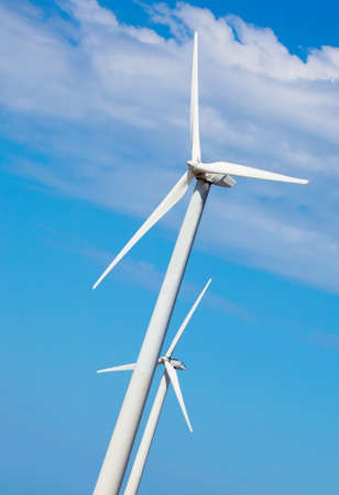 Wind energy generator with blue skyの写真素材