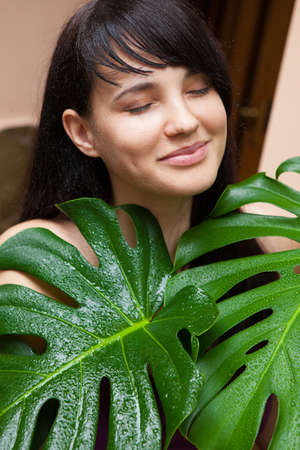 Beautiful brunette girl in gardenの写真素材