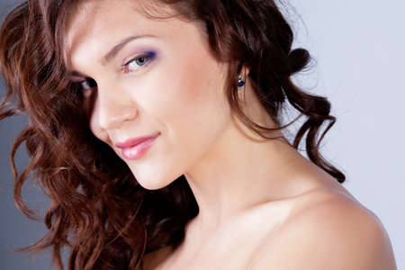 Beautiful brunette girl with healthy hair in studioの写真素材