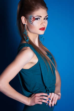 Girl with fantasy make-up in studioの写真素材