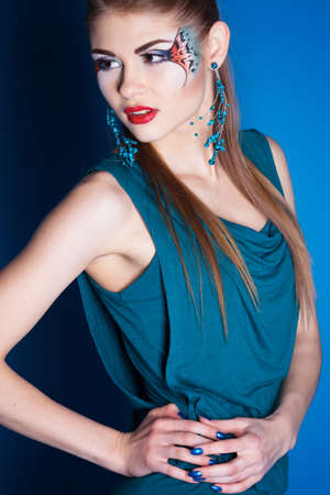 Girl with fantasy make-up in studioの写真素材