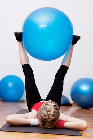 Girl training in fitness clubの写真素材