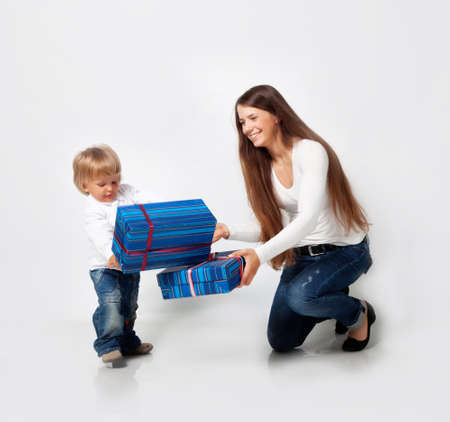 Mother playing with son in studioの写真素材