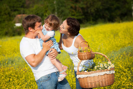 Family on the flower meadowの写真素材