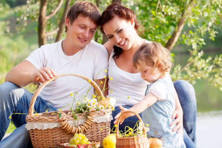 Family on picnic near the lakeの写真素材
