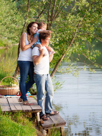 Family on picnic near the lakeの写真素材