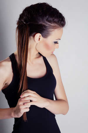Beautiful girl with hairstyle portrait in studioの写真素材