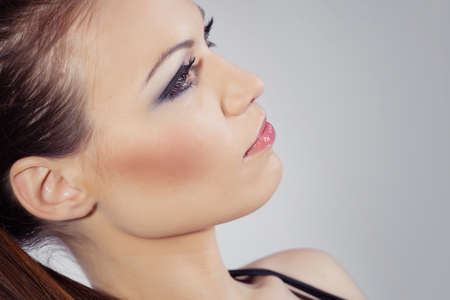 Beautiful girl with hairstyle portrait in studioの写真素材