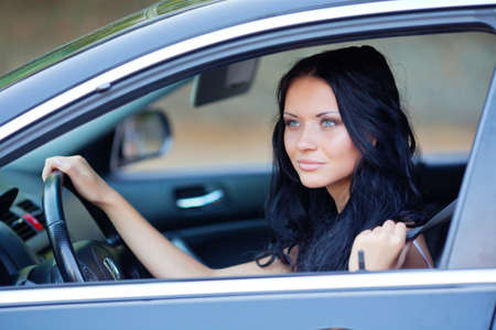 Young beautiful woman in the carの写真素材