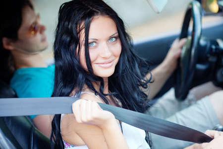 Young beautiful woman with driver in the carの写真素材