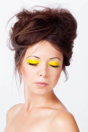 Woman with bright makeup isolated on whiteの写真素材