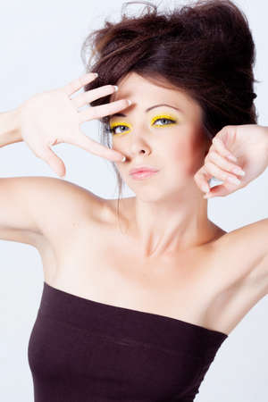 Woman with bright makeup isolated on whiteの写真素材