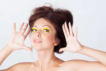 Woman with bright makeup isolated on whiteの写真素材