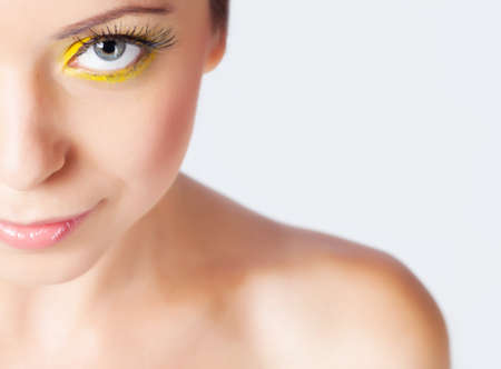 Woman with bright makeup isolated on whiteの写真素材