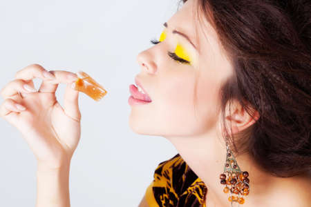 Woman with bright makeup isolated on whiteの写真素材