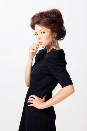 Woman in black dress isolated on whiteの写真素材
