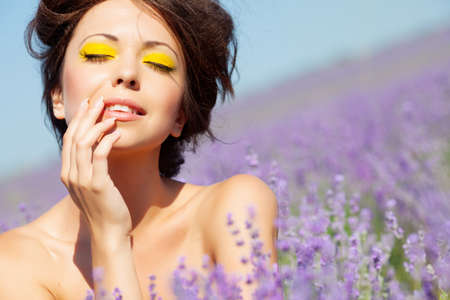 Beautiful girl on the lavender fieldの写真素材