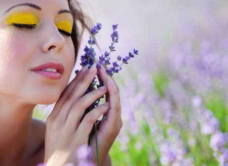 Beautiful girl on the lavender fieldの写真素材