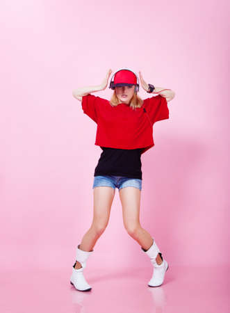 Beautiful girl dancing hip-hop in studioの写真素材