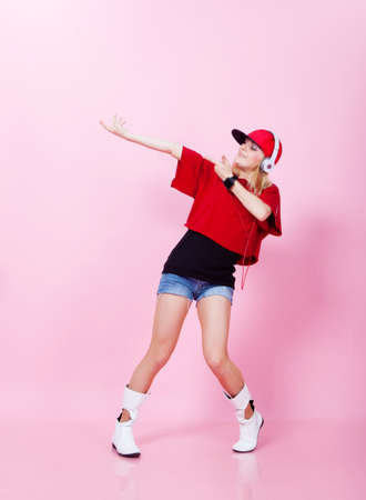 Beautiful girl dancing hip-hop in studioの写真素材