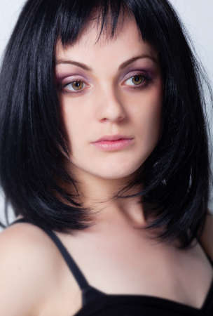 Woman with bright makeup isolated on greyの写真素材