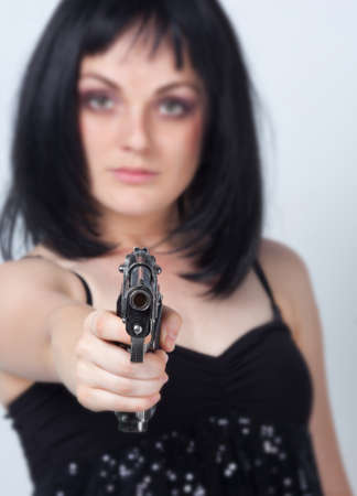 Woman with big gun in hand の写真素材