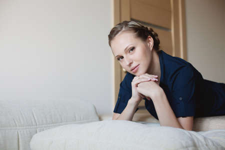 Beautiful woman lying on the bed at home