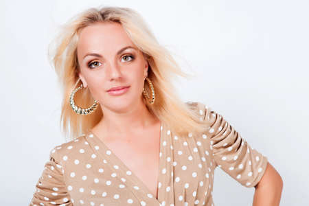 Beautiful blond hair girl isolated in studioの写真素材