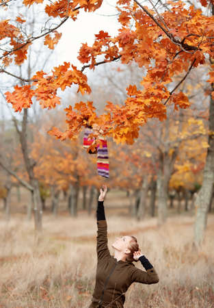 Beautiful girl in autumn parkの写真素材