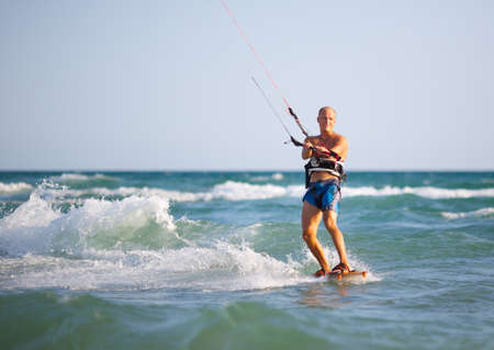 Man with kitesurf on the beachの写真素材