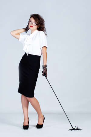 Strict teacher with glasses and a whipの写真素材